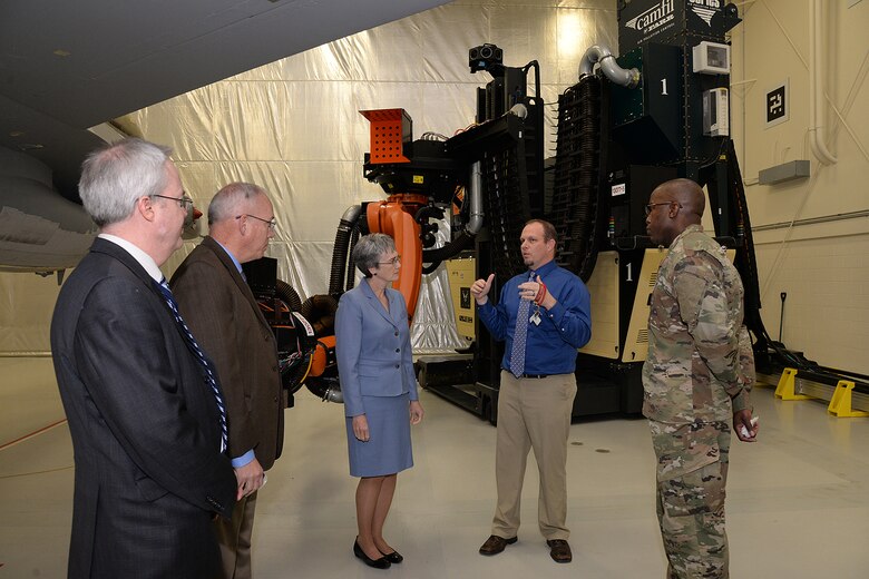 Richard Crowther, 309th Aircraft Maintenance Group engineer, briefs Air Force Secretary Heather Wilson on the F-16 laser depaint system during a base visit Jan. 24, 2019, at Hill Air Force Base, Utah. The 309th AMXG is part of the Ogden Air Logistics Complex at Hill AFB, which is responsible for depot maintenance, repair, overhaul and modification of the A-10, C-130, T-38, F-16, F-22, F-35 and the Minuteman III Intercontinental Ballistic Missile system. (U.S. Air Force photo by Alex R. Lloyd)