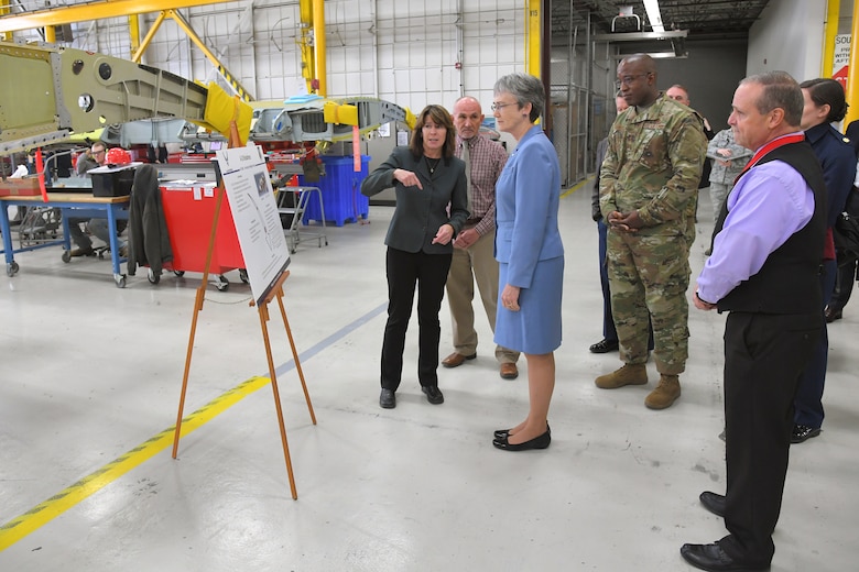 Dawn Sutton, A-10 program manager, discusses A-10 Thunderbolt II readiness and sustainment with Air Force Secretary Heather Wilson during a base visit, Jan. 24, 2019, at Hill Air Force Base, Utah. (U.S. Air Force photo by Todd Cromar)
