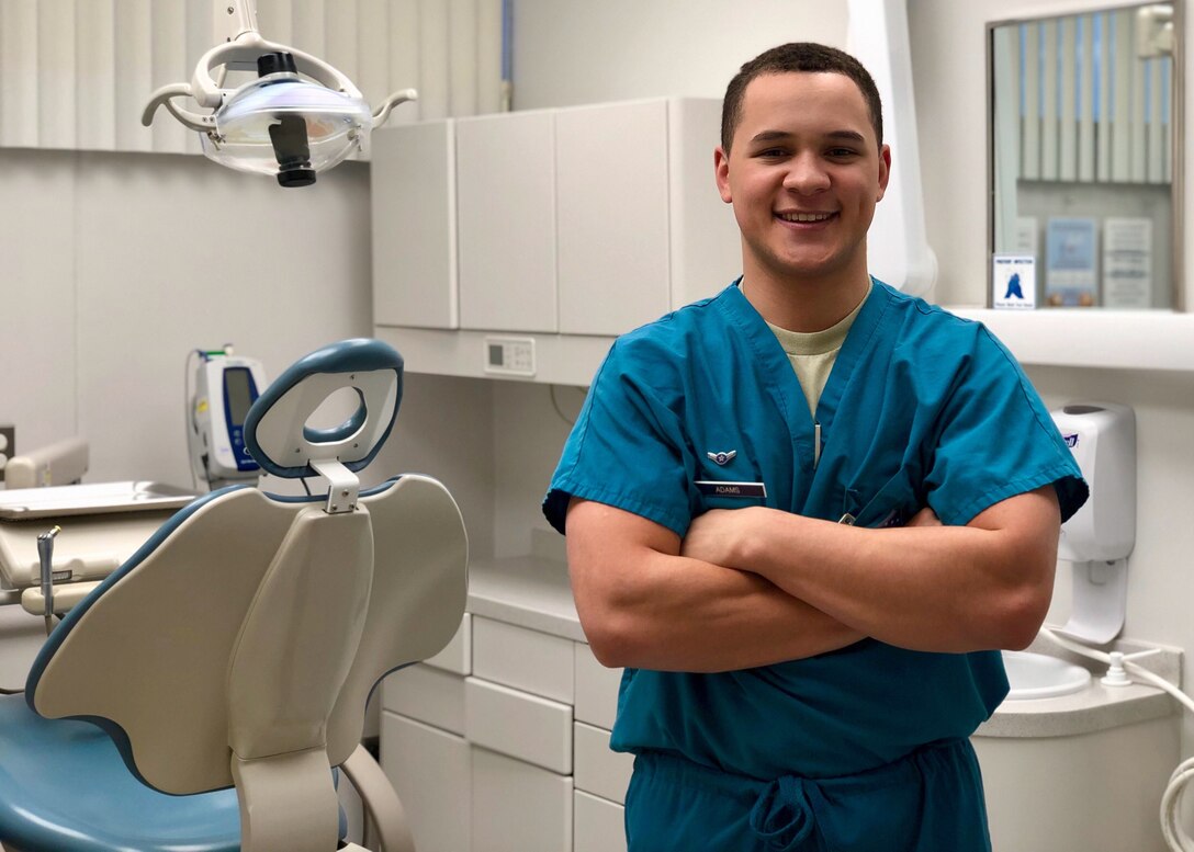 Airman Reginald Adams, 90th Medical Operations Squadron dental technician, stands in a dental treatment room Jan. 24, 2018, at F. E. Warren Air Force Base, Wyo. As a dental technician, Adams is responsible for working alongside dentists to provide patient care in all procedures; from simple exams and taking x-rays, to assisting in oral surgery. (U.S. Air Force photo by Tech. Sgt. Ashley Manz)