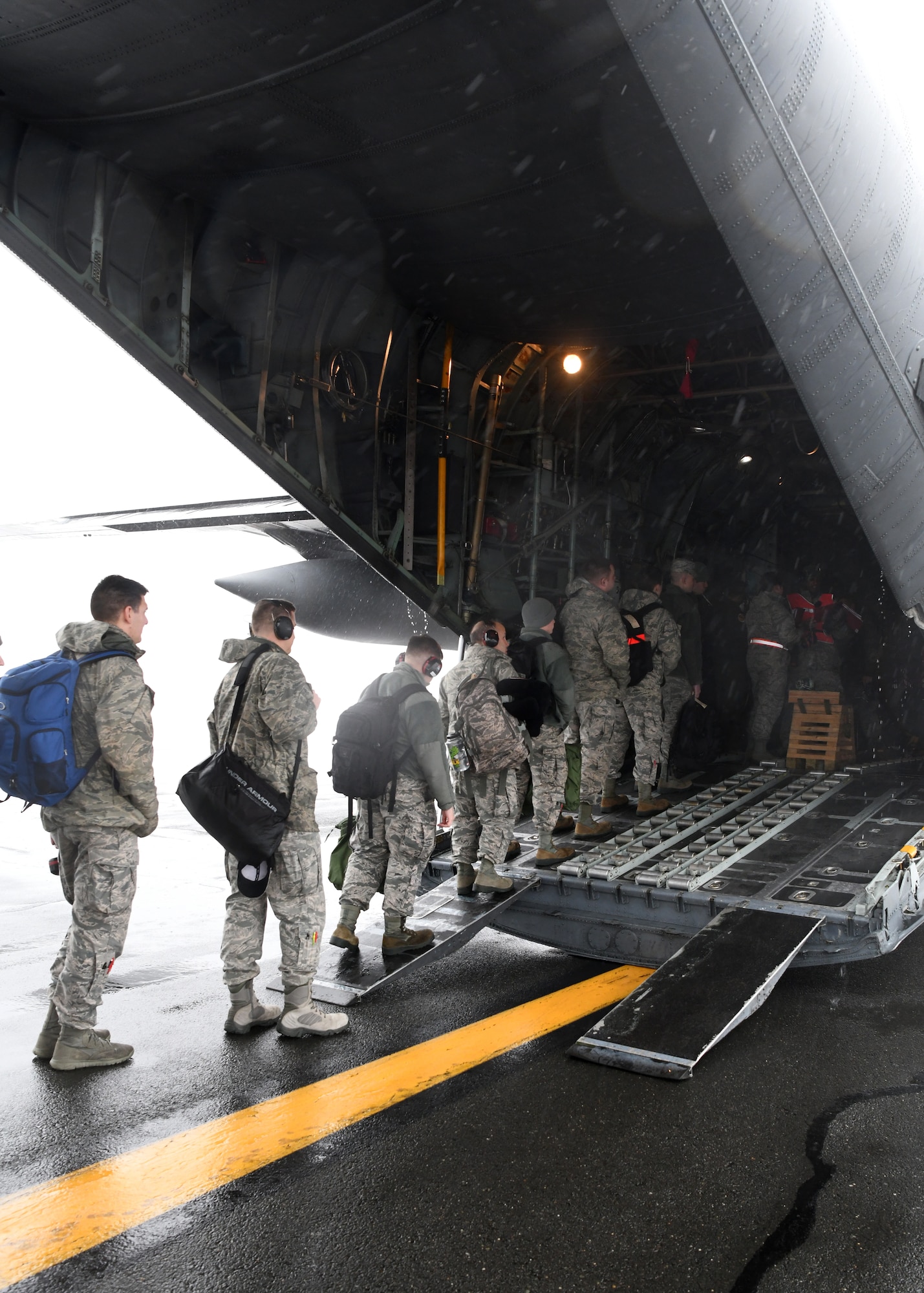 104th Fighter Wing Airmen board a C-130 Hercules Jan. 24, 2019, at Barnes Air National Guard Base, Massachusetts. The Airmen are going to Patrick Air Force Base where they will train to help them prepare for various situations.  (U.S. Air National Guard photos by Airman Sara Kolinski)