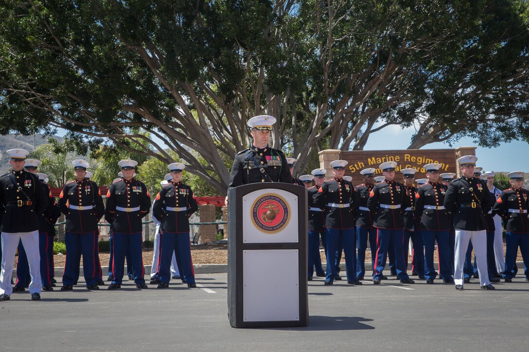 U.S. Marine Corps Lt. Col. John Gianopoulos, the commanding officer of 5th Marine Regiment, 1st Marine Division, speaks during the 5th Marines Vietnam War Memorial unveiling ceremony in the Camp San Mateo Memorial Garden at Marine Corps Base Camp Pendleton, Calif., May 28, 2018.