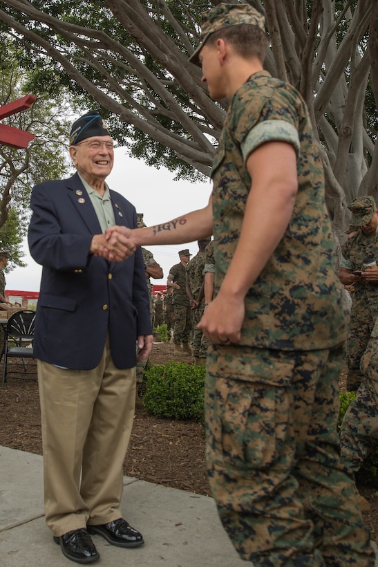Retired U.S. Marine Corps Chief Warrant Officer 4 Hershel “Woody” Williams, the last surviving Medal of Honor recipient of the battle of Iwo Jima, center, greets Marines during his visit to the 5th Marine Regiment Vietnam War Memorial at Marine Corps Base Camp Pendleton, Calif., May 29, 2018.