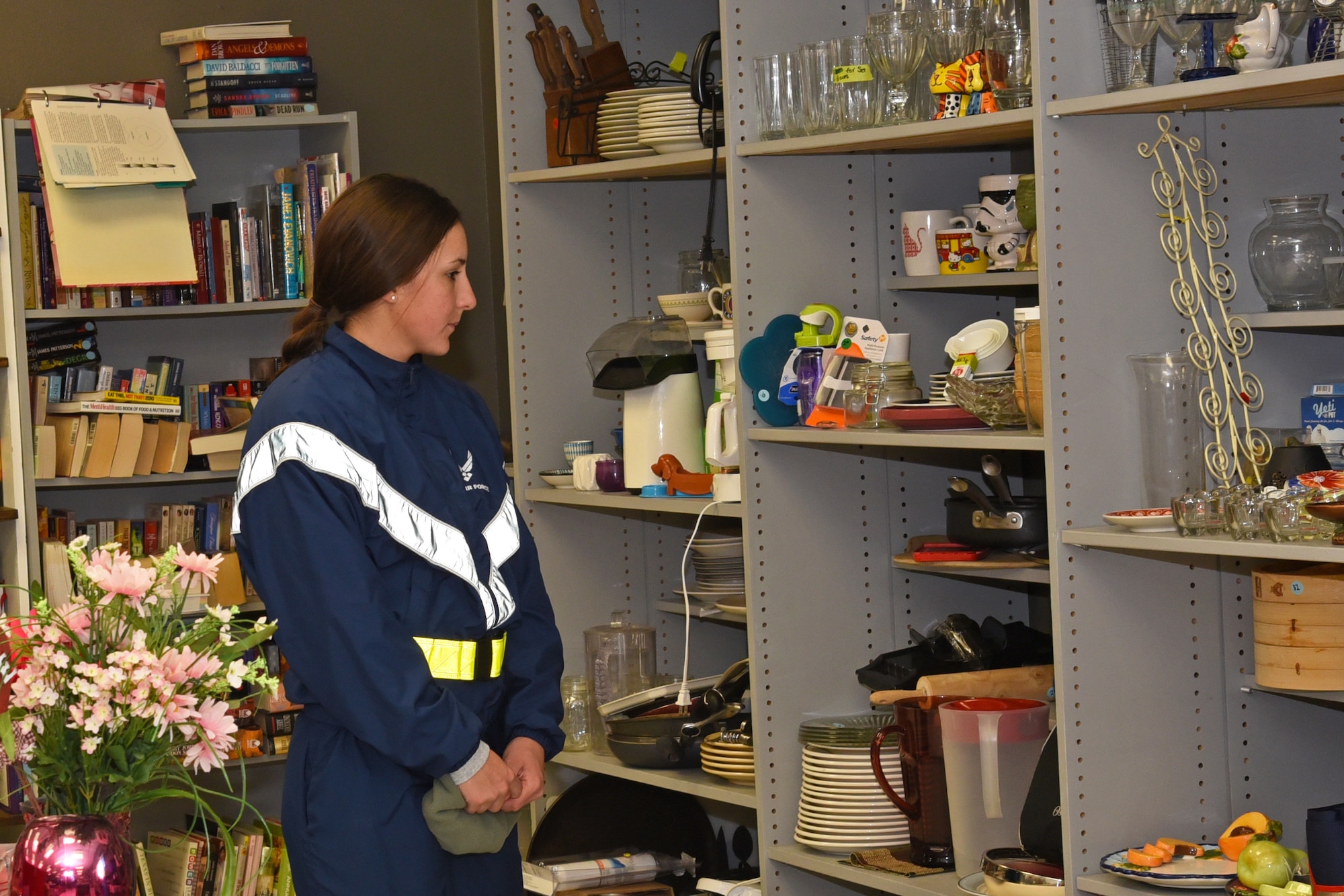 U.S. Air Force Airman 1st Class Taylor Amezquita, 316th Training Squadron student, shops for dishware at the Goodfellow Spouses’ Club Thrift Store on Goodfellow Air Force Base, Jan. 19, 2019. Amezquita arrived to Goodfellow two weeks ago and intended to purchase dishes to use in her dormitory. (U.S. Air Force photo by Airman 1st Class Abbey Rieves/Released)