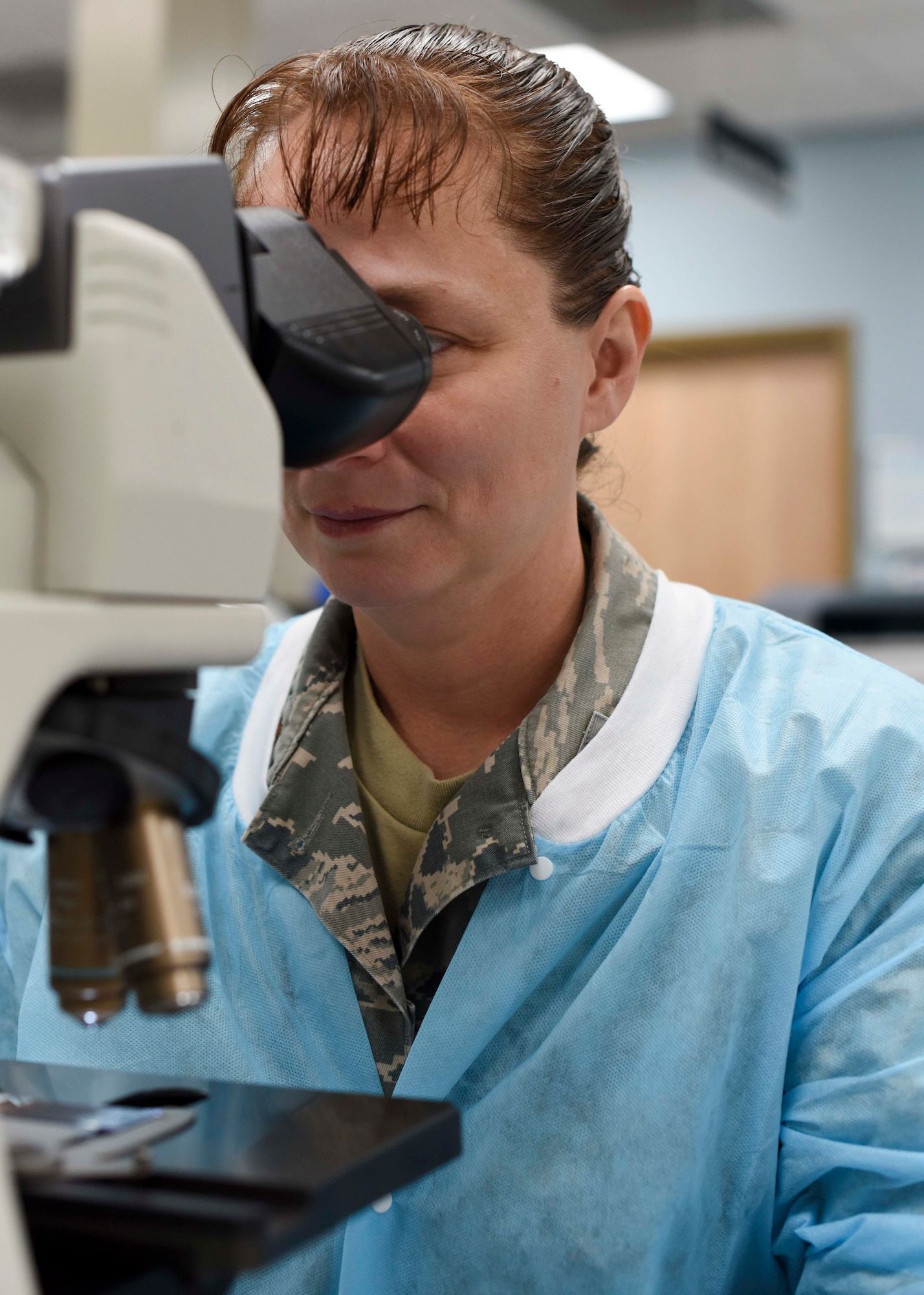 Maj. Rebecca Bird, 49th Medical Group laboratory flight commander, analyzes a blood drop specimen, Jan. 24, 2019, on Holloman Air Force Base, N.M. As a biomedical scientist, Bird is able to test all the chemicals and cells in the body to screen for a variety of diseases and medical conditions, and ensure the body is properly balanced. (U.S. Air Force photo by Staff Sgt. BreeAnn Sachs)