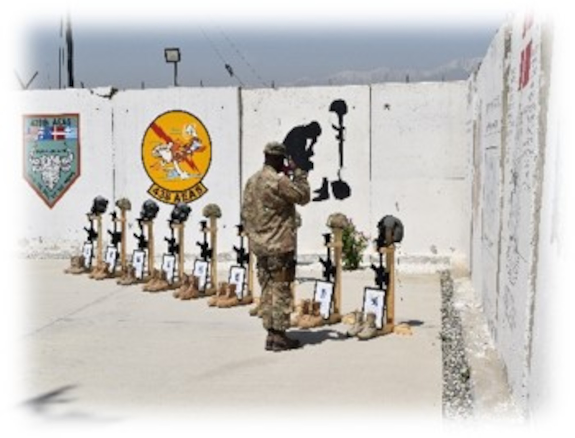 Airman salutes at a memorial display on April 27, 2018, in Kabul, Afghanistan.