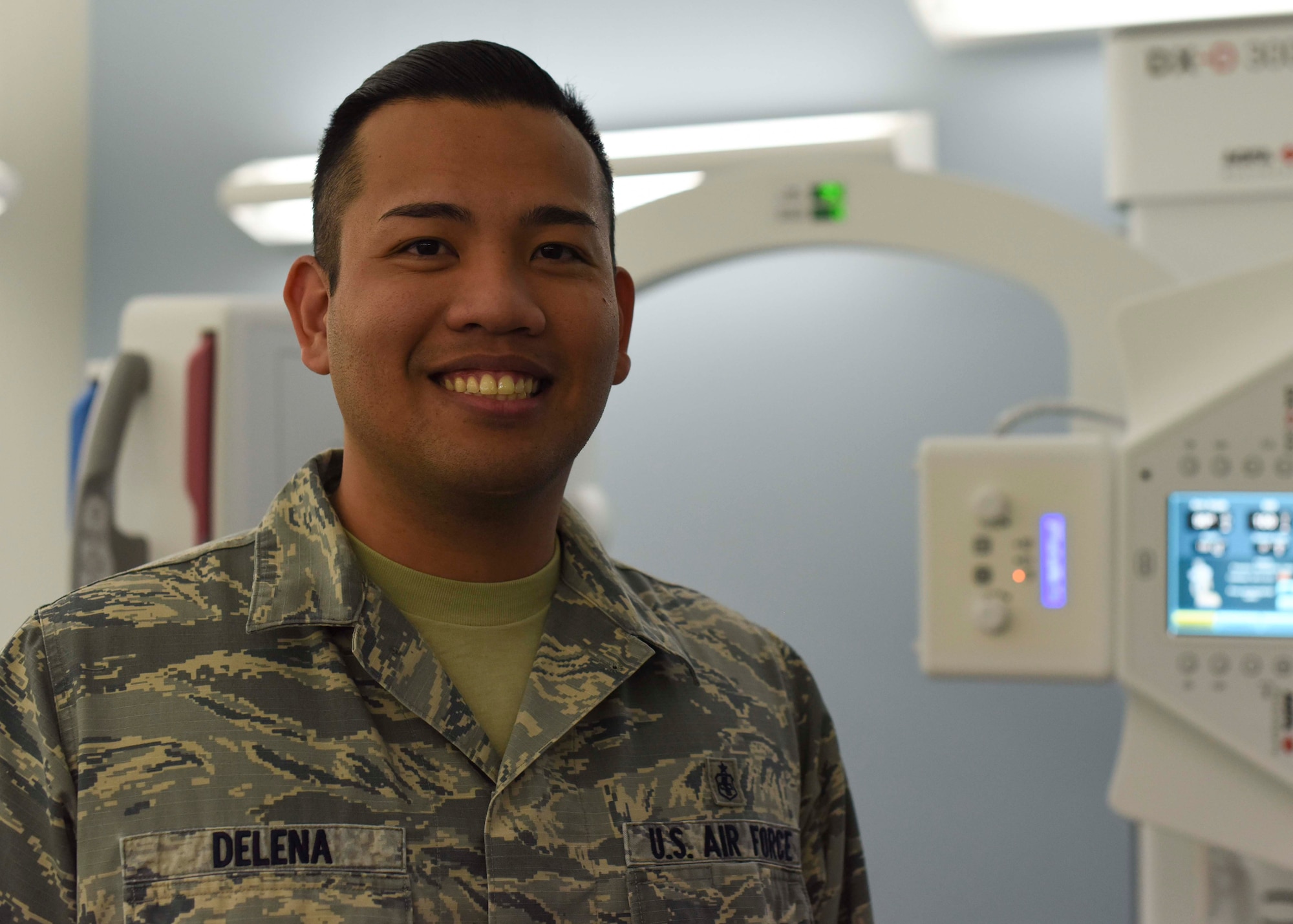 Staff Sgt. Englebert Delena, 49th Medical Group diagnostic imaging technologist, poses in front of a direct capture x-ray machine, Jan. 23, 2019, on Holloman Air Force Base, N.M. Delena is one of three diagnostic imaging technologists in the Radiology Clinic, who assists up to 2,000 patients annually. (U.S. Air Force photo by Staff Sgt. BreeAnn Sachs)