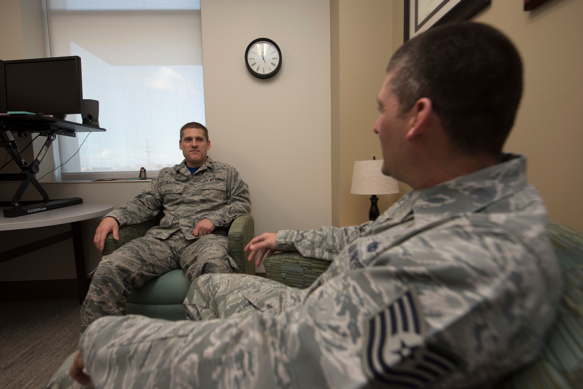 Maj. Spencer Clayton, 49th MDG Mental Health flight commander, speaks to an Airman, Jan. 14, 2019, on Holloman Air Force Base, N.M. Mental Health staff are responsible for the overall mental well-being of Airmen across the base, and they work to keep Airmen fit to complete the mission, as well as live a happy life. (U.S. Air Force photo by Staff Sgt. Timothy Young)