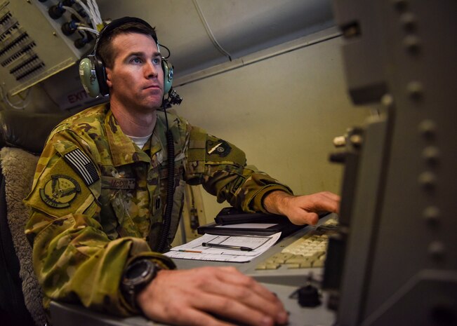 An Airman reviews radar imagery.
