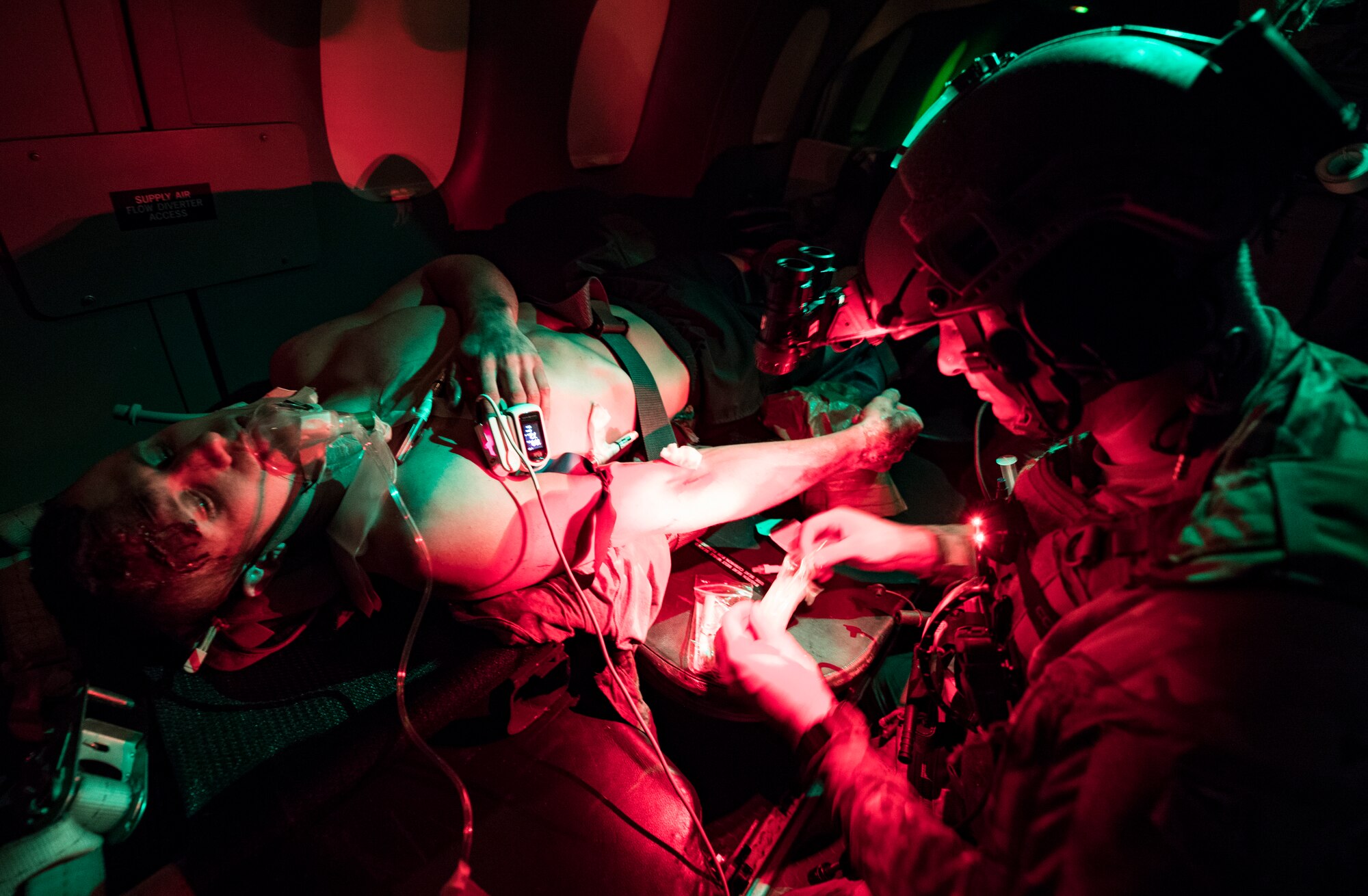 A U.S. Air Force special operations force medical element works with Royal Danish Air Force medical personnel to treat patients aboard a C-146 Dornier aircraft at Hurlburt Field, Fla., during flight operations for casualty evacuation and critical care training as part of exercise Emerald Warrior 19, Jan. 17, 2019. Emerald Warrior provides annual realistic and relevant pre-deployment training, encompassing multiple joint operating areas. This training prepares special operations forces, conventional force enablers, partner nations, and interagency elements to integrate with and execute full-spectrum special operations in a complex and uncertain irregular warfare security environment, and uses aspects of live, virtual, and constructive training assets. (U.S. Air Force photo by Tech. Sgt. Gregory Brook)