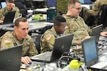 U.S. Army Sgt. Brandon Miller (left), Pfc. Karl Powell (middle)  and Cpl. Alexander Bishop (right), monitor simulated disaster data in the web-based Common Operational Picture at the Joint Task Force Civil Support (JTF-CS) Joint Operations Center during Exercise Sudden Response 19 in Fayetteville, N.C., on January 26, 2019. Miller and Powell are geospatial engineers with the 543rd geospatial planning cell, and Bishop is multisystem channel maintainer with the 76th operational response command. (Official DoD photo by Staff. Sgt. Jeramy Moore/released)