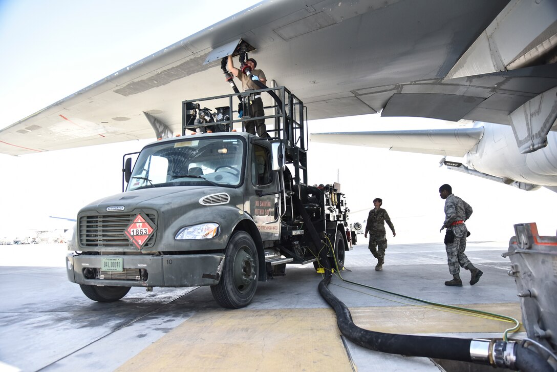 U.S. Airmen assigned to the 380th Expeditionary Logistics Readiness Squadron fuels flight use an R-12 Hydrant Servicing Vehicle to refuel a KC-10 Extender at Al Dhafra Air Base, United Arab Emirates, Jan. 21, 2019. This vehicle pumps fuel from a tank approximately one mile away directly into the aircraft. (U.S. Air Force photo by Senior Airman Mya M. Crosby)