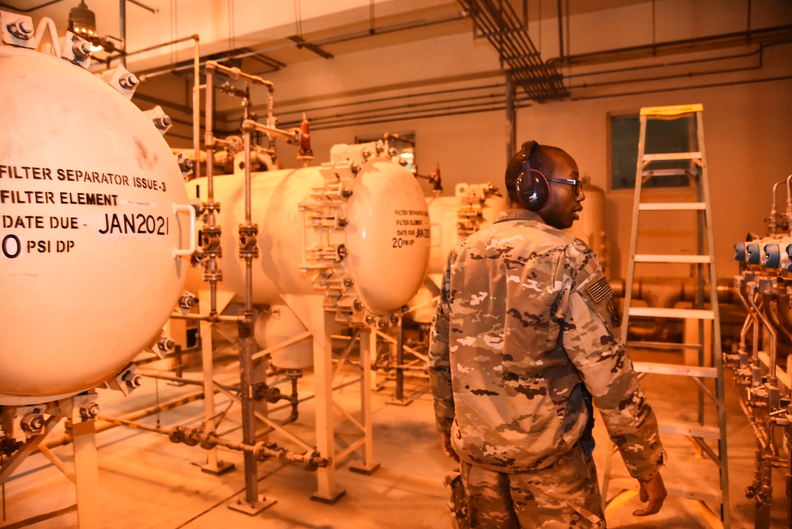 U.S. Air Force Senior Airman Melvin Tucker, 380th Expeditionary Logistics Readiness Squadron fuels storage technician, inspects Bubba, a Type-3 hydrant system, at Al Dhafra Air Base, United Arab Emirates, Jan. 21, 2019. Tucker is one of the many Airmen responsible for operating the hydrant system that monitors and controls the fuel from the storage tanks all the way to the flight line and into the aircraft. (U.S. Air Force photo by Senior Airman Mya M. Crosby)