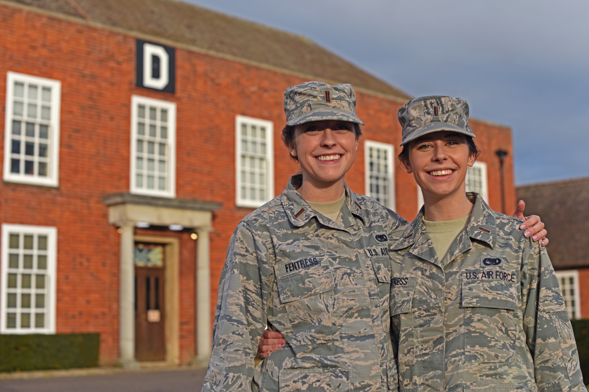 U.S. Air Force 2nd Lt. Reagan Fentress, left, 100th Logistics Readiness Squadron Deployment and Distribution flight commander, and U.S. Air Force 2nd Lt. Blythe Fentress, 727th Air Mobility Squadron Air Terminal Operations Center Officer-in-charge, pose for a photo at RAF Mildenhall, England, Jan. 8, 2019. Reagan attended the U.S. Air Force Academy, while Blythe commissioned after attending the U.S. Merchant Marine Academy in New York.  (U.S. Air Force photo by Airman 1st Class Brandon Esau)