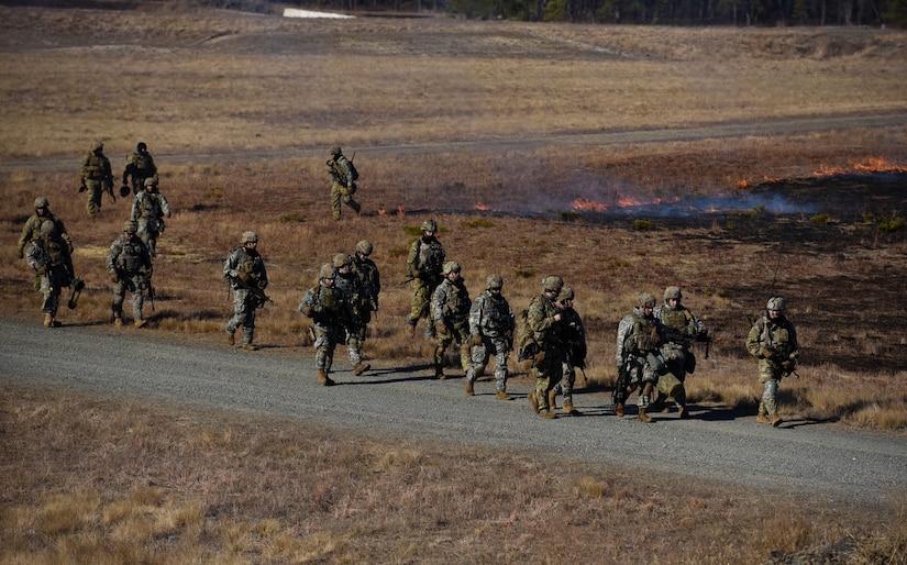Soldiers assigned to the 2-325th Airborne Infantry Regiment from Fort Bragg, North Carolina walk off the range after completing their yearly gunnery qualification training on Joint Base McGuire-Dix-Lakehurst, New Jersey, Jan. 15, 2019. The regiment traveled here for training in the cold-weather, preparing for the possibility of being called anywhere in the world. (U.S. Air Force photo by Airman 1st Class Ariel Owings)