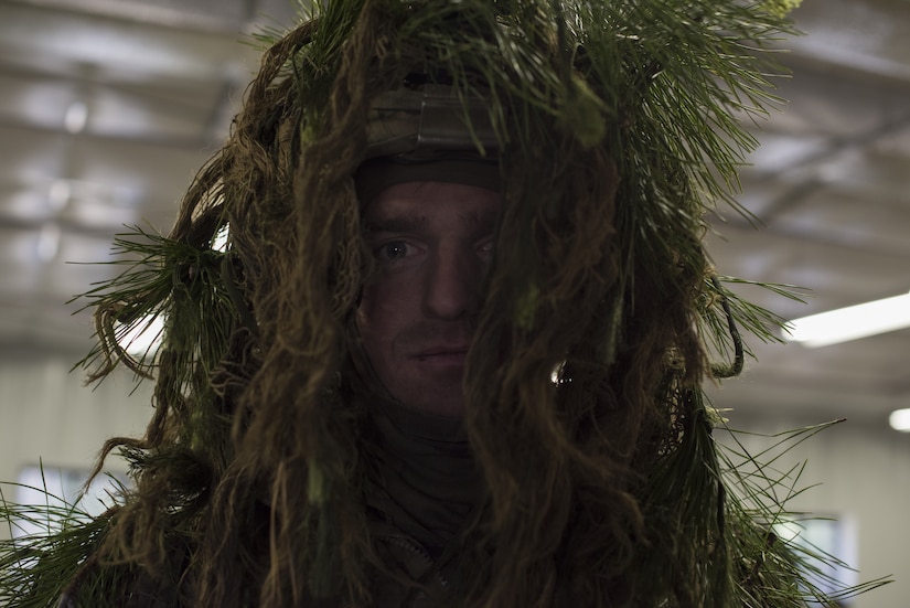 A 2-325th Airborne Infantry Regiment Soldier wears a ghillie suit to disguise himself during cold-weather gunnery qualification training on Joint Base McGuire-Dix-Lakehurst, New Jersey, Jan. 15, 2019. The camouflage not only disguised the Soldier from the opposing team, but gave him extra warmth during the winter training. (U.S. Air Force photo by Airman 1st Class Ariel Owings)