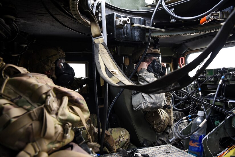 Soldiers from the 2-325th Airborne Infantry Regiment communicate to another team on the HUMVEE radio during the live fire portion of the cold-weather gunnery qualification training on Joint Base McGuire-Dix-Lakehurst, New Jersey, Jan. 17, 2019. Mastering inter-squad communication builds a foundation for a good platoon and increases the speed and value of the training. (U.S. Air Force photo by Airman 1st Class Ariel Owings)