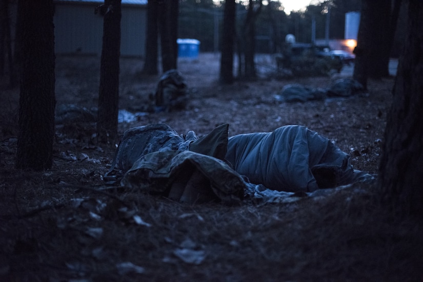 A 2-325th Airborne Infantry Regiment Soldier sleeps during the cold-weather gunnery qualification training on Joint Base McGuire-Dix-Lakehurst, New Jersey, Jan. 17, 2019. Each Soldier slept on the ranges with just their sleeping bag for at least five nights with temperatures in the single digits. (U.S. Air Force photo by Airman 1st Class Ariel Owings)