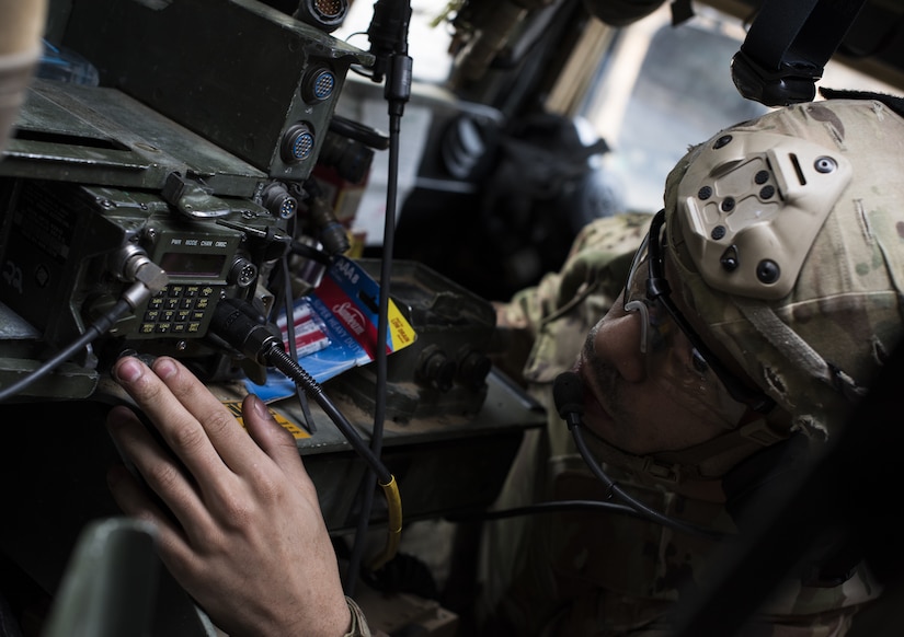 A Soldier assigned to the 2-325th Airborne Infantry Regiment checks a radio in a HUMVEE during the cold-weather gunnery qualification training on Joint Base McGuire-Dix-Lakehurst, New Jersey, Jan. 17, 2019. The team lost communication with the HUMVEE nearby and had to find a different channel in order to contact each other. (U.S. Air Force photo by Airman 1st Class Ariel Owings)