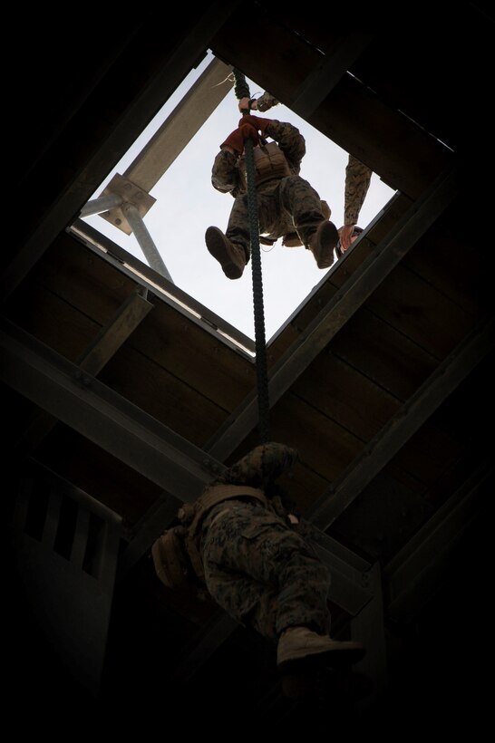 U.S. Marines and Sailors with Alpha company, 1st Battalion, 2nd Marine Regiment, 2nd Marine Division, participate in fast rope training at Camp Lejeune, N.C., April 26, 2018. Each Marine rappelled with packs and a combat load to simulate real life scenarios in preparation for an upcoming deployment with 22nd Marine Expeditionary Unit. (U.S. Marine Corps photo by Lance Cpl. Caleb T. Maher)