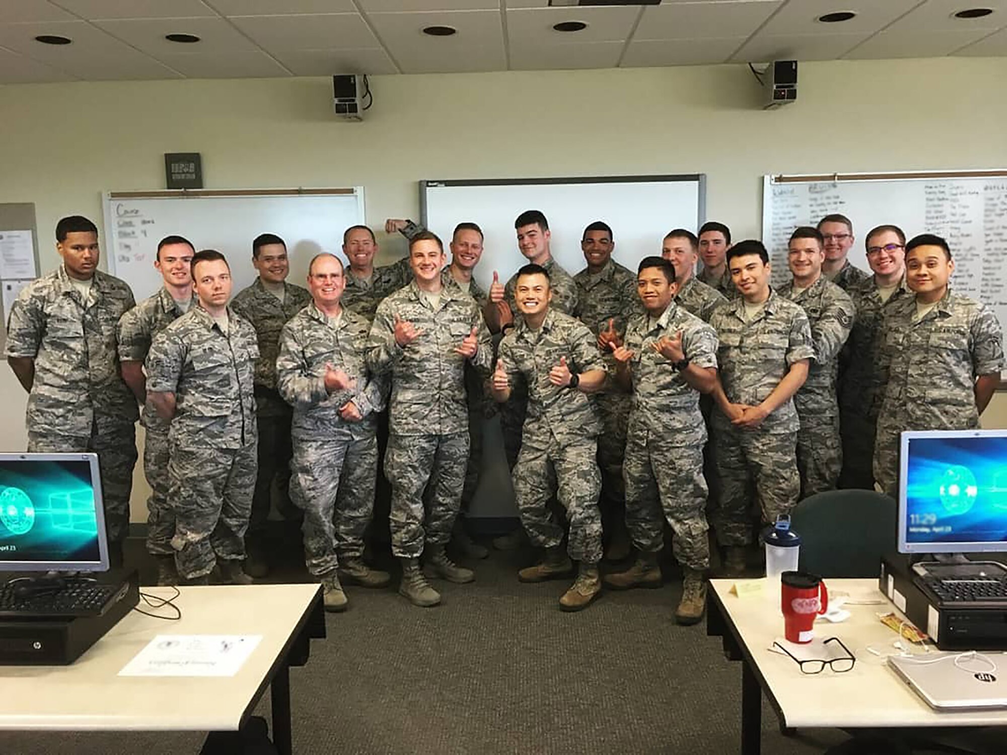 Shown here with is technical school class, Senior Airman Joe Chau, 718th Intelligence Squadron cyber systems operations technician, distinguish himself at technical school not only as a student, but also as a tutor. While there, he initiated an informal tutoring group which quickly grew from three classmates to more than 40 participants, promoted and endorsed by his tech school instructors.