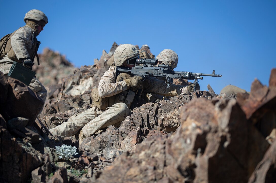 A Marine prepares an M240B machine gun for live-fire training.