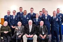 This group photo was taken October 13, 2018 in the officers' lounge at Joint Base Andrews, Maryland, to mark the reunion of the 490th of yesterday and today. From left to right starting in the back are Capt. Tony Ferrelli, Lt. Ariana Henry, Lt. Mitch Nairn, Maj. Chris Boney, Senior Airman Todd Conley, Lt. Kyla Thrasher, Capt. Ryan Potts, Maj. Marc Keller, Lt. Kinsey Richmond, Master Sgt. Matthew Manning, Lt. Col. Troy Stauter. The front row from left to right are retired Maj. Charles Good, retired Staff Sgt. Murry Schenker, Joe Barrett and Tom Bristol. (Photo courtesy Capt. Tony Ferrelli)