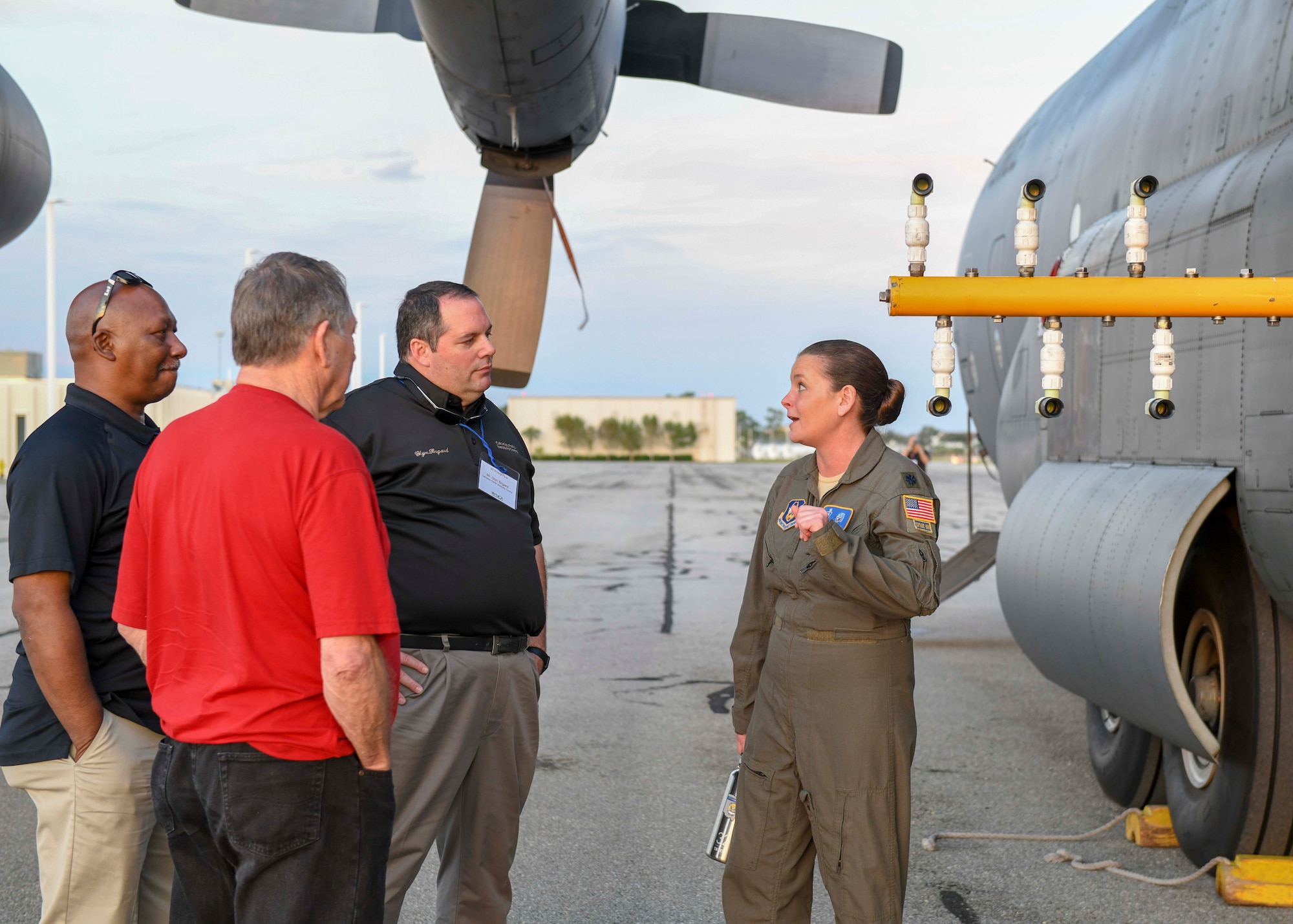 Lt. Col. Jen Remmers, an entomologist assigned to the 910th Airlift Wing's 757th Airlift Squadron, explains to attendees the nozzle types and configurations used on a C-130H Hercules during aerial spray operations, Jan. 8, 2019 at Page Field in Lee County, Florida.