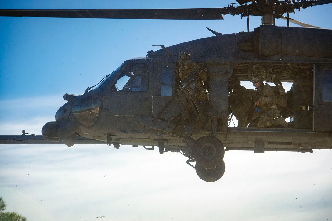 A 41st Rescue Squadron (RQS) HH-60G Pave Hawk helicopter ‘hard crew’ transports pararescuemen from the 38th RQS during pre-deployment ‘spin-up’ training, Dec. 12, 2018, at Avon Park Air Force Range, Fla. To optimally perform their Combat Search and Rescue mission downrange, the 347th Rescue Group implemented the advanced training ‘hard crew’ system, which unifies the 38th and 41st RQS’s into separate rescue operator teams that’ll fly every mission together for their upcoming deployment. This concept establishes continuity and chemistry which will help maximize the 38th and 41st RQS’s mission readiness by simultaneously working together to build relationships and understand each other’s idiosyncrasies, strengths, and weaknesses to ultimately improve the team’s performance in mission execution. (U.S. Air Force photo by Senior Airman Greg Nash)