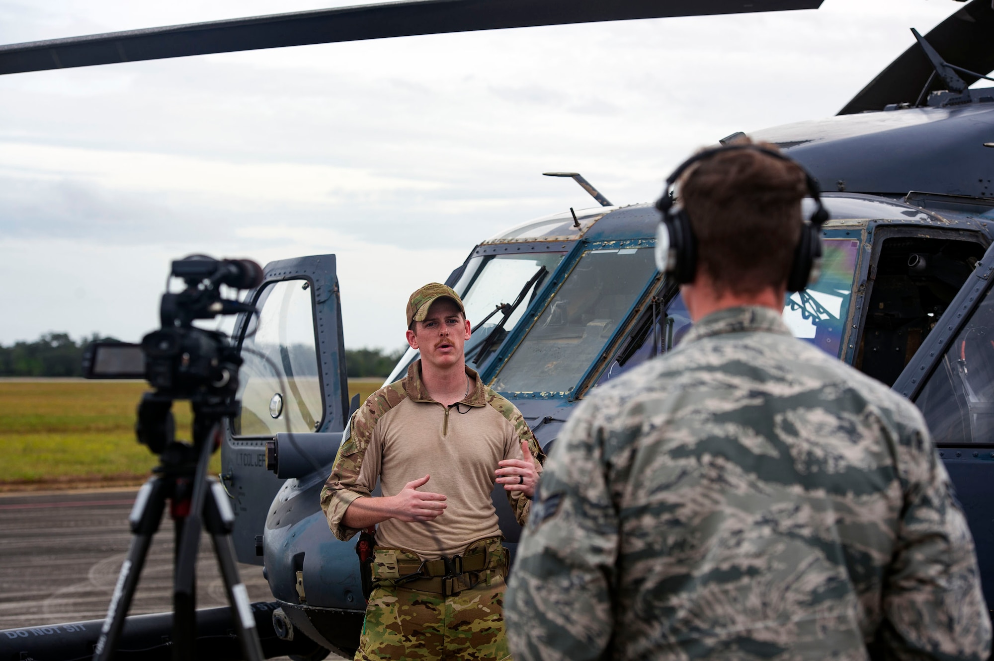 Capt. Jesse Reynolds, 41st Rescue Squadron HH-60G Pave Hawk helicopter pilot, discusses the advantages of operating as a ‘hard crew’ during an interview as part of pre-deployment ‘spin-up’ training, Dec. 14, 2018, at Avon Park Air Force Range, Fla. To optimally perform their Combat Search and Rescue mission downrange, the 347th Rescue Group implemented the advanced training ‘hard crew’ system, which unifies the 38th and 41st RQS’s into separate rescue operator teams that’ll fly every mission together for their upcoming deployment. This concept establishes continuity and chemistry which will help maximize the 38th and 41st RQS’s mission readiness by simultaneously working together to build relationships and understand each other’s idiosyncrasies, strengths, and weaknesses to ultimately improve the team’s performance in mission execution. (U.S. Air Force photo by Senior Airman Greg Nash)