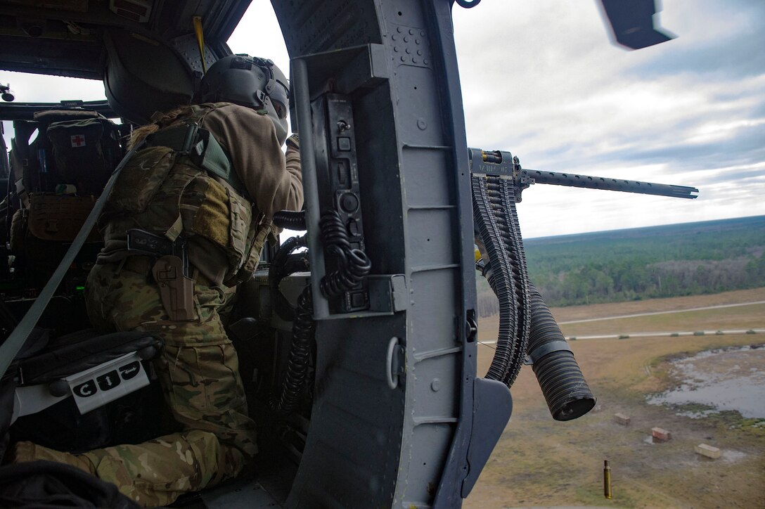 Airman 1st Class Lauren Cox, 41st Rescue Squadron special missions aviator, fires an M2 machine gun from an HH-60G Pave Hawk helicopter during routine training, Jan.16, 2019, at Grand Bay Bombing and Gunnery Range, Ga. To optimally perform their Combat Search and Rescue mission downrange, the 347th Rescue Group implemented the advanced training ‘hard crew’ system, which unifies the 38th and 41st RQS’s into separate rescue operator teams that’ll fly every mission together for their upcoming deployment. This concept establishes continuity and chemistry which will help maximize the 38th and 41st RQS’s mission readiness by simultaneously working together to build relationships and understand each other’s idiosyncrasies, strengths, and weaknesses to ultimately improve the team’s performance in mission execution. (U.S. Air Force photo by Senior Airman Greg Nash)