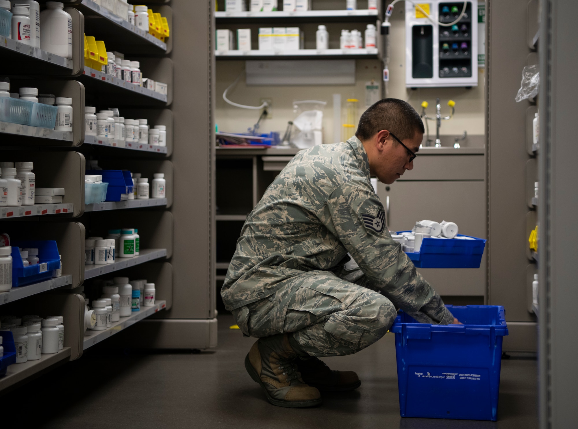 Staff Sgt. Brandtlee Maluenda, 436th Medical Group pharmacy technician, stocks the shelves with medication Jan. 22, 2019, at Dover Air Force Base, Delaware. Team Dover’s pharmacy is unique in that it is primarily staffed by volunteers, including civilians. (U.S. Air Force photo by Airman 1st Class Zoe M. Wockenfuss)