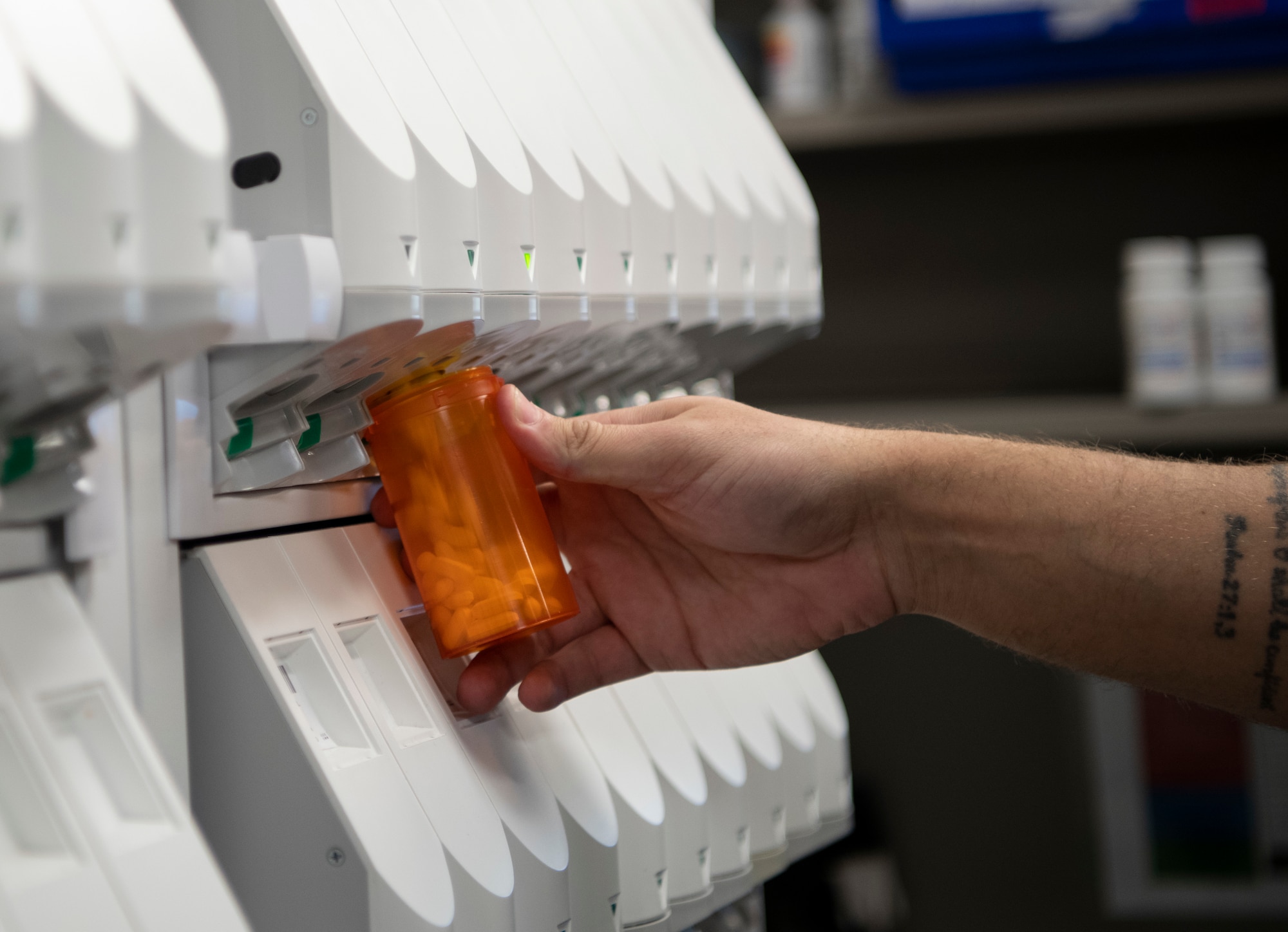 Medication is dispensed into a pill bottle by an Automatic Dispensing Cabinet Jan. 22, 2019, at the 436th Medical Group pharmacy at Dover Air Force Base, Delaware. Team Dover’s pharmacy is unique in that it is primarily staffed by volunteers. (U.S. Air Force photo by Airman 1st Class Zoe M. Wockenfuss)