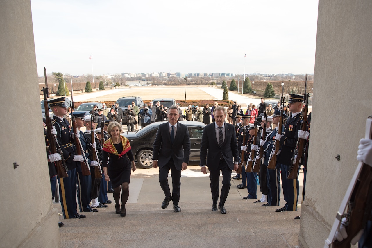 Acting defense secretary and NATO secretary general enter the Pentagon.