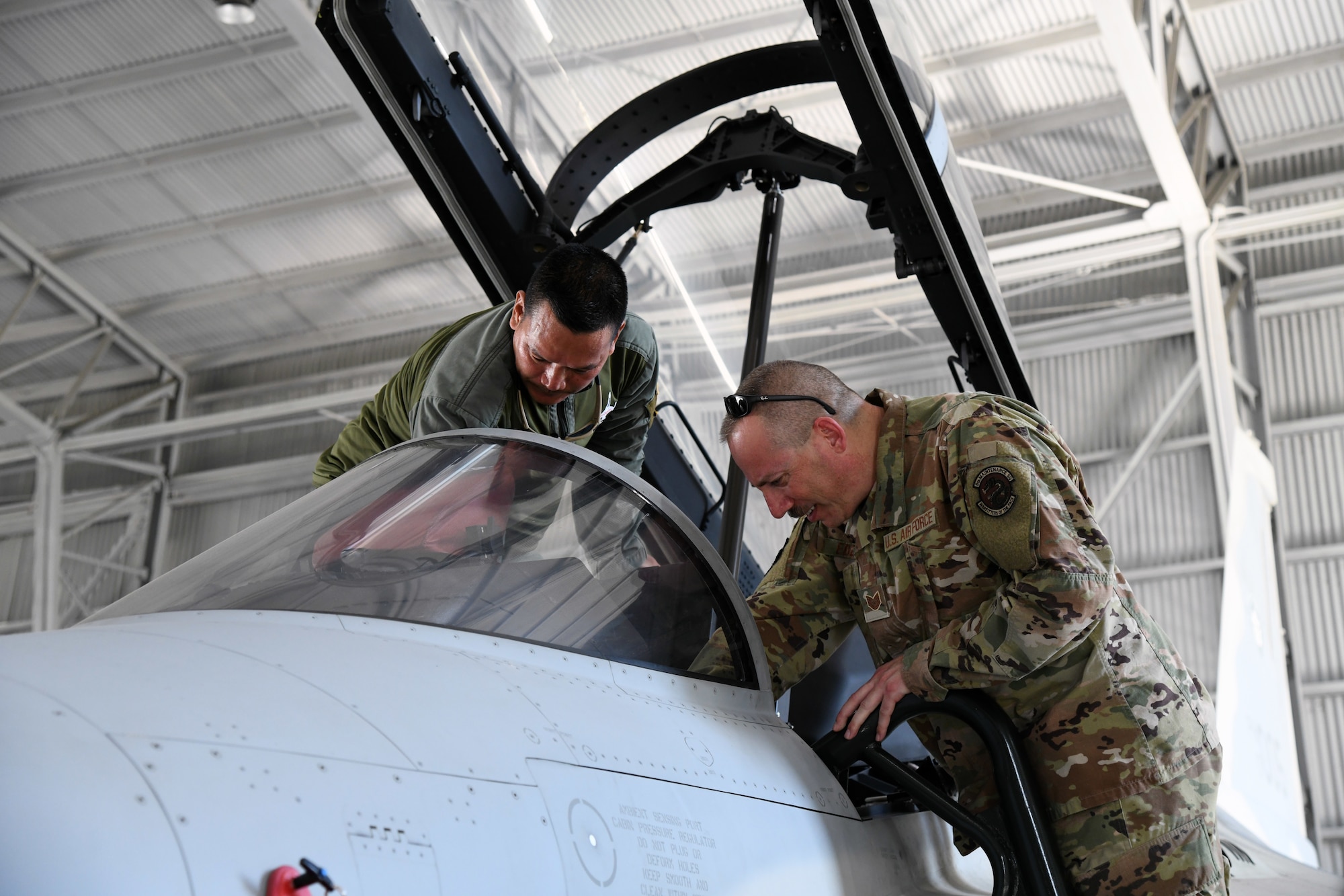 Philippine Air Force Tech. Sgt. Roderick Domingo, 430th Aircraft Maintenance Group Egress system supervisor, and U.S. Air Force Tech Sgt. Ed Edens, 113th Maintenance Squadron Egress system mechanic, perform a visual inspection of a Philippine Air Force FA-50 during the Bilateral Air Contingent Exchange-Philippines (BACE-P) at Cesar Basa Air Base, Philippines, Jan. 22, 2019.