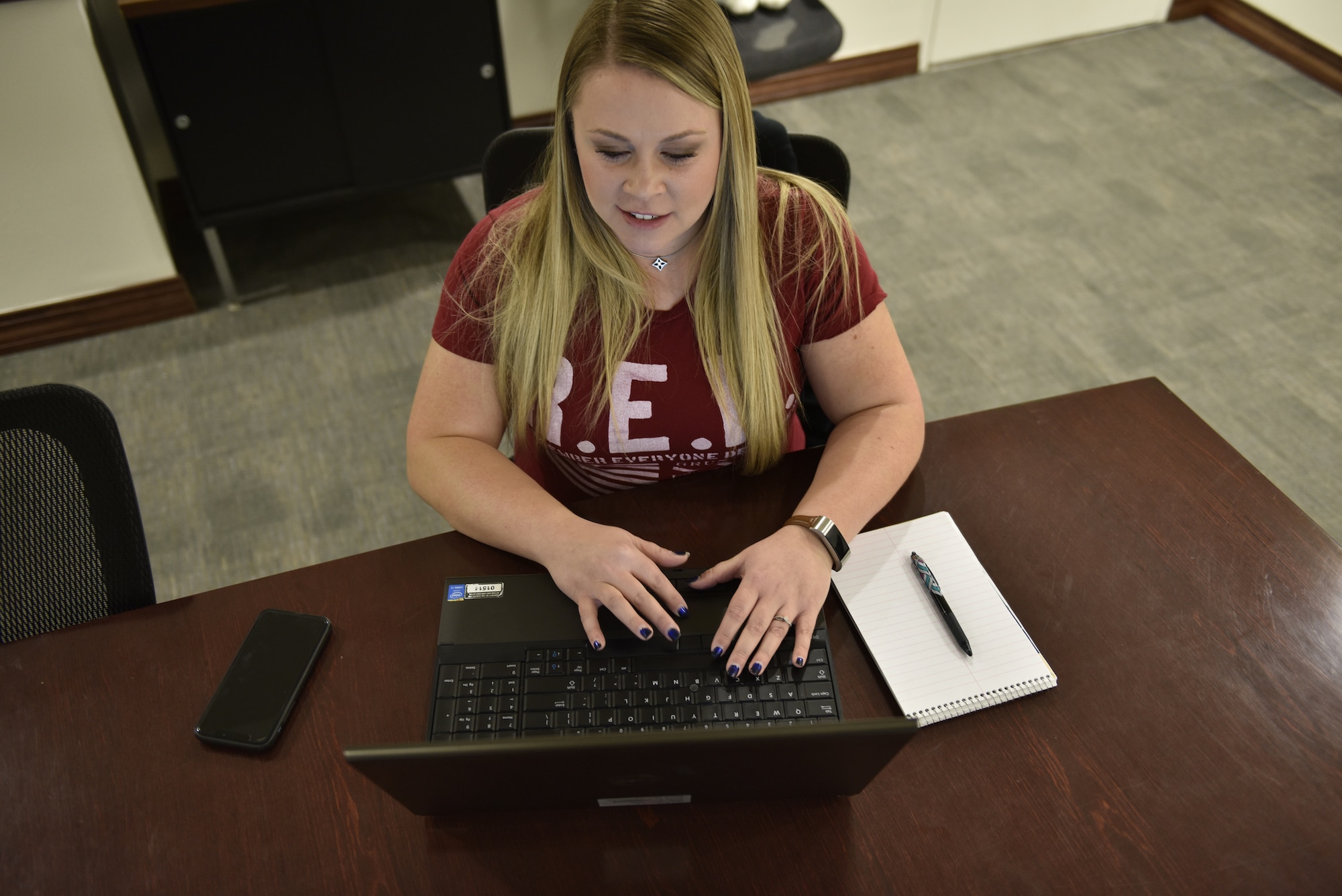 Morgan Levison, Kirtland Air Force Base Information Central Facebook group administrator, works on her computer at Kirtland AFB, N.M., Jan. 25, 2019. The KAFBIC group has 2,290 members and had 329 posts last month. Administrators of the group have to approve or deny each post before it is allowed to be on the page. (U.S. Air Force photo by Airman 1st Class Austin J. Prisbrey)