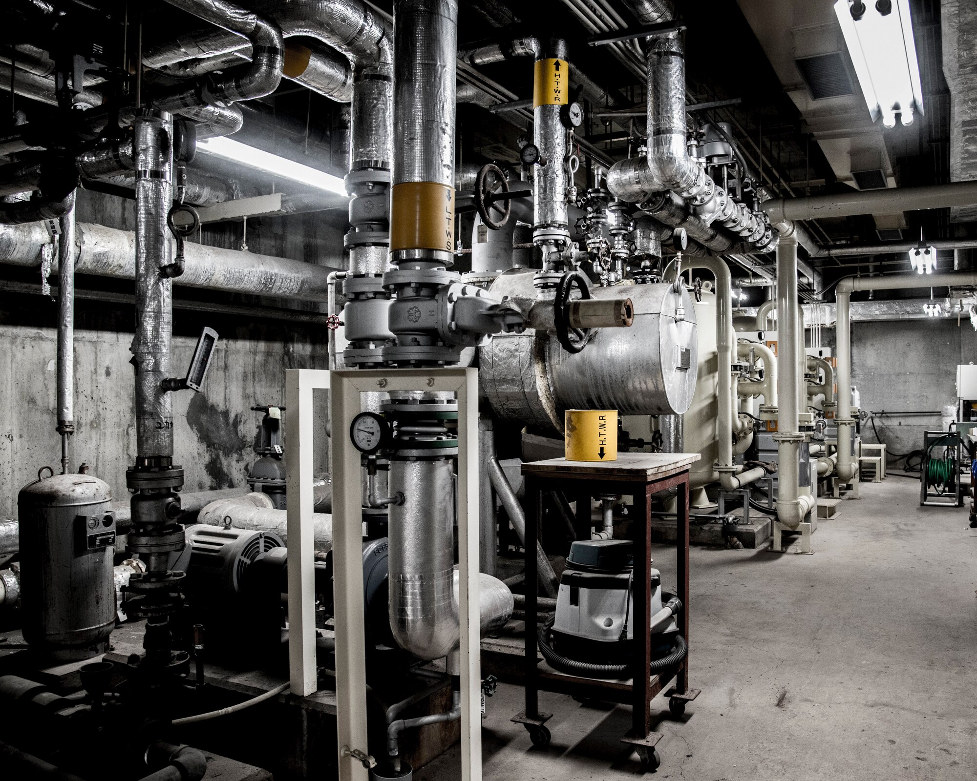 Equipment that keeps the pool operational such as, filters, heaters and a circulation system sit on the basement of the pool at Yokota Air Base, Japan, Jan. 23, 2019. The 374th Civil Engineer Squadron along with contractors have been working to fix damaged equipment, and also to protect them in the future. (U.S. Air Force photo by Machiko Arita)