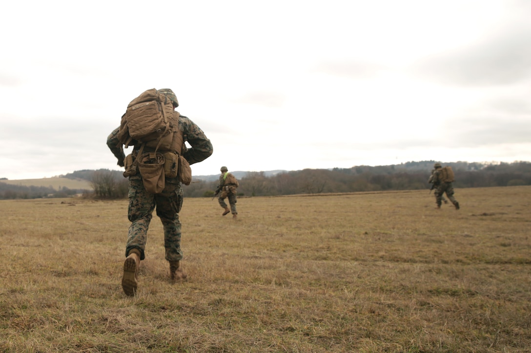 U.S. Marines with Special Purpose Marine Air-Ground Task Force- Crisis Response- Africa 19.1 advance on an objective during a platoon attack on a live-fire range in Baumholder, Germany, Jan. 16, 2019. SPMAGTF-CR-AF is deployed to conduct crisis-response and theater-security operations in Europe and Africa. (U.S. Marine Corps photo by Cpl. Bethanie Ryan)