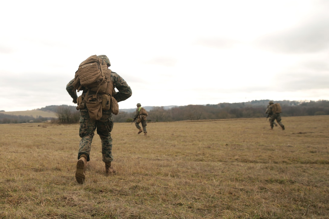 U.S. Marines with Special Purpose Marine Air-Ground Task Force- Crisis Response- Africa 19.1 advance on an objective during a platoon attack on a live-fire range in Baumholder, Germany, Jan. 16, 2019