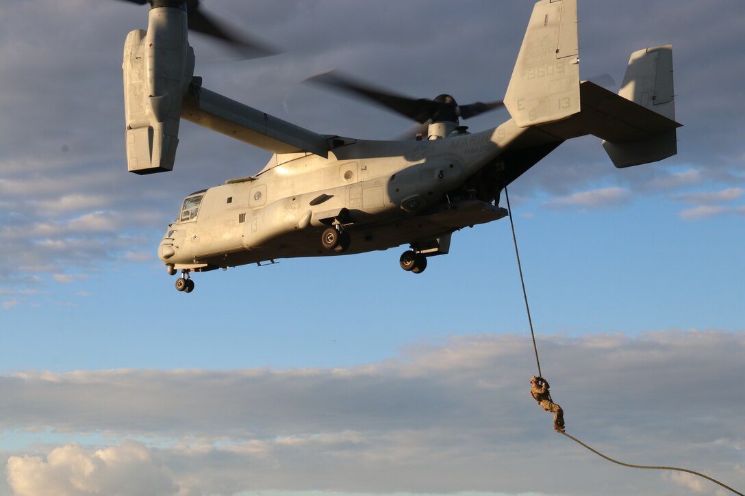 A U.S. Air Force pararescue jumper attached to Special Purpose Marine Air-Ground Task Force-Crisis Response-Africa 19.1 conducts fast-rope insertion drills from a MV-22 Osprey at Naval Air Station Sigonella, Italy, Jan. 7, 2019.