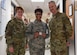 U.S. Air Force Lt. Gen. Dorothy A. Hogg, Air Force Surgeon General, and Chief Master Sgt. G. Steve Cum, Medical Enlisted Force and Enlisted Corps chief, present a coin to Master Sgt. Teronda L. Hunter, 633rd Dental Squadron clinical flight chief, at Joint Base Langley-Eustis, Virginia, Jan. 9, 2019.