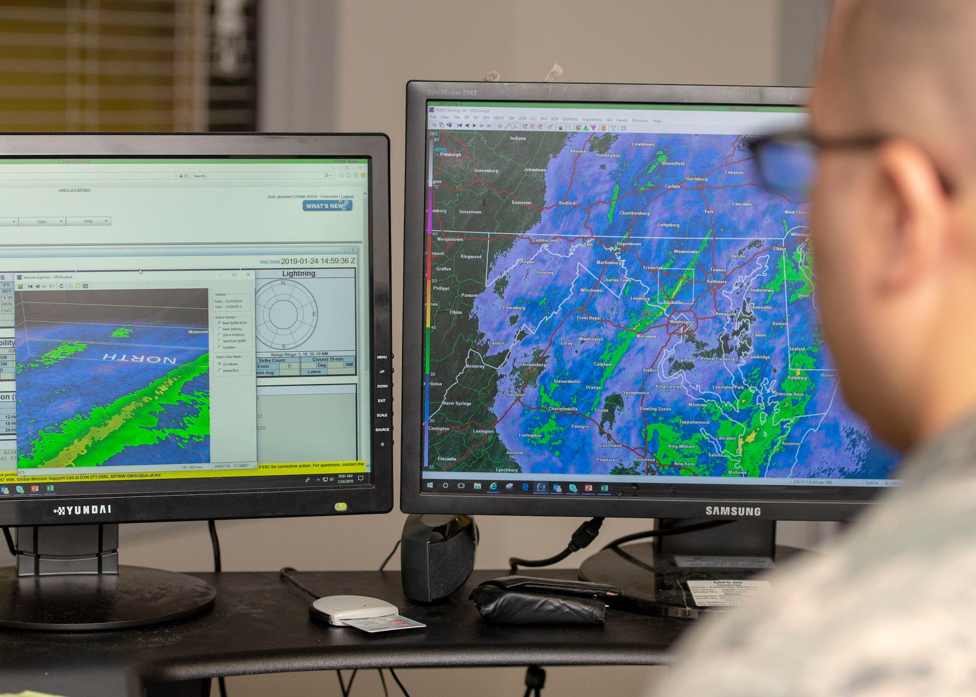 Staff Sgt. Ivan Guzman, 436th Operations Support Squadron weather forecaster, looks over an approaching weather system Jan. 24, 2019, Dover Air Force Base, Delaware. During the spring and summer, forecasters are able to use equipment to produce a 3-D generated model, allowing them to better understand where hazardous weather is and where aircraft can fly. (U.S. Air Force photo by Staff Sgt. Jared Duhon)