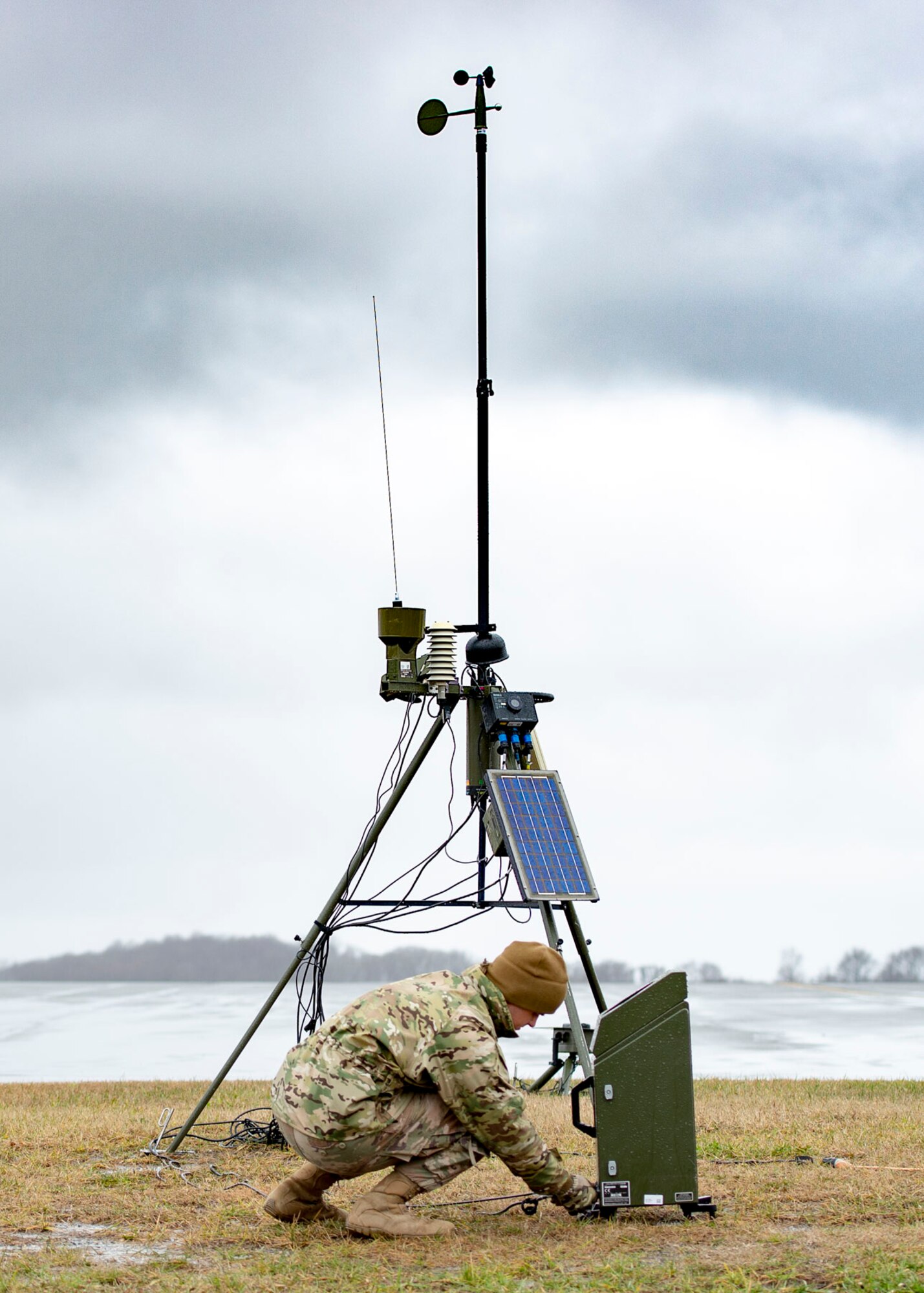 Senior Airman Aaron Cathey, 436th Operations Support Squadron weather forecaster, inspects connections of a tactical meteorological observation system Jan. 24, 2019, on Dover Air Force Base, Delaware. The equipment provides redundancy for stationary equipment around the runway and is also capable of being used in a deployed environment. (U.S. Air Force photo by Staff Sgt. Jared Duhon)
