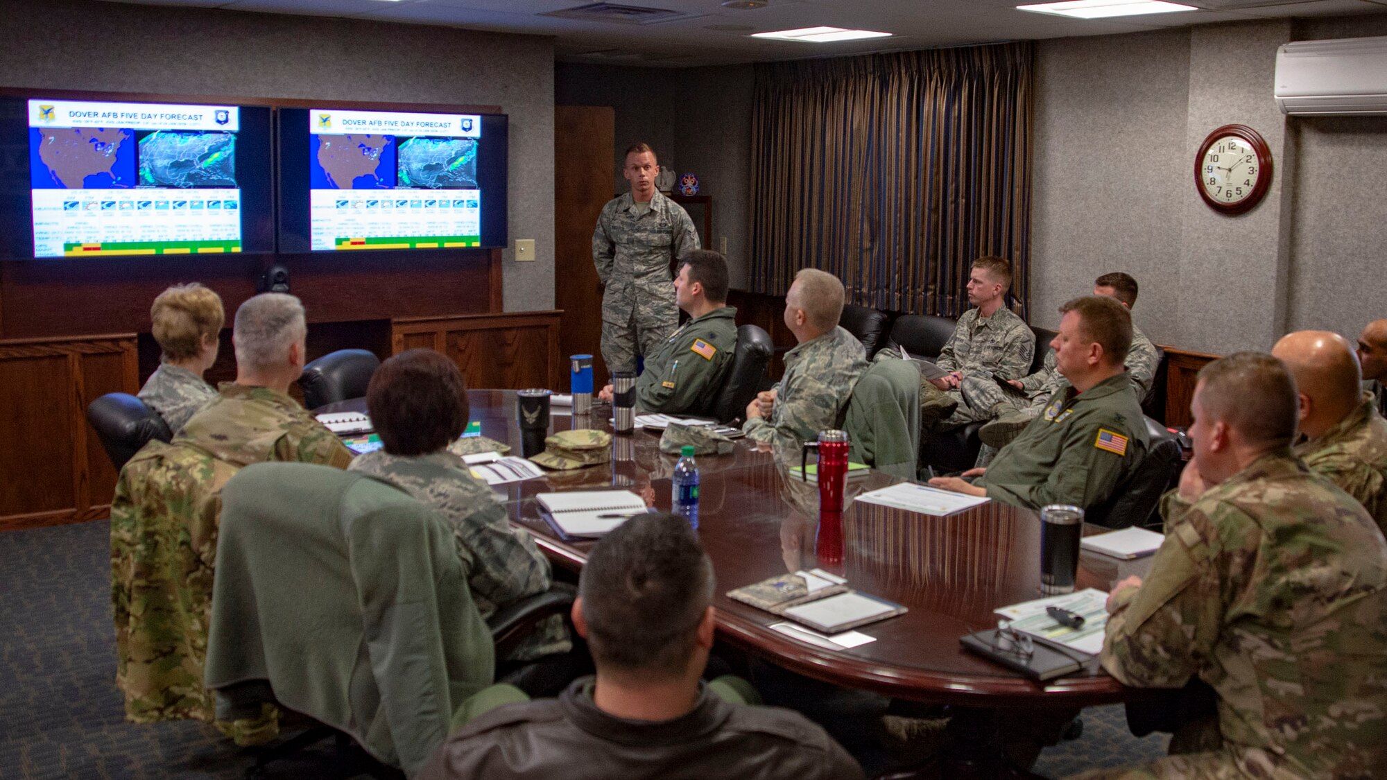 Airman 1st Class Jeremy Knighton, 436th Operations Support Squadron weather forecaster, illustrates upcoming weather during a morning briefing Jan. 25, 2019, on Dover Air Force Base, Delaware. Weather briefings ensure decision-makers understand upcoming weather conditions and how they may affect Airmen. (U.S. Air Force photo by Staff Sgt. Jared Duhon)