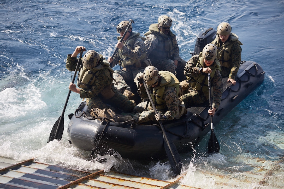 U.S. Marines with Alpha Company, Battalion Landing Team, 1st Battalion, 4th Marine Regiment, the 'China Marines,' launch a Combat Rubber Raiding Craft during a simulated boat raid aboard the dock landing ship USS Ashland (LSD 48) in the  Philippine Sea Jan. 25, 2019.