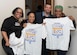 Biggest Loser competition participants show their t-shirts with Tony Arroyo, 633rd Force Support Squadron fitness director, at Joint Base Langley-Eustis, Virginia, Jan. 22, 2019. Participants received t-shirts during the initial weigh-ins for the Biggest Loser competition, as they begin the eight-week challenge conducted at Shellbank Fitness Center. (U.S. Air Force photo by Airman 1st Class Marcus M. Bullock)