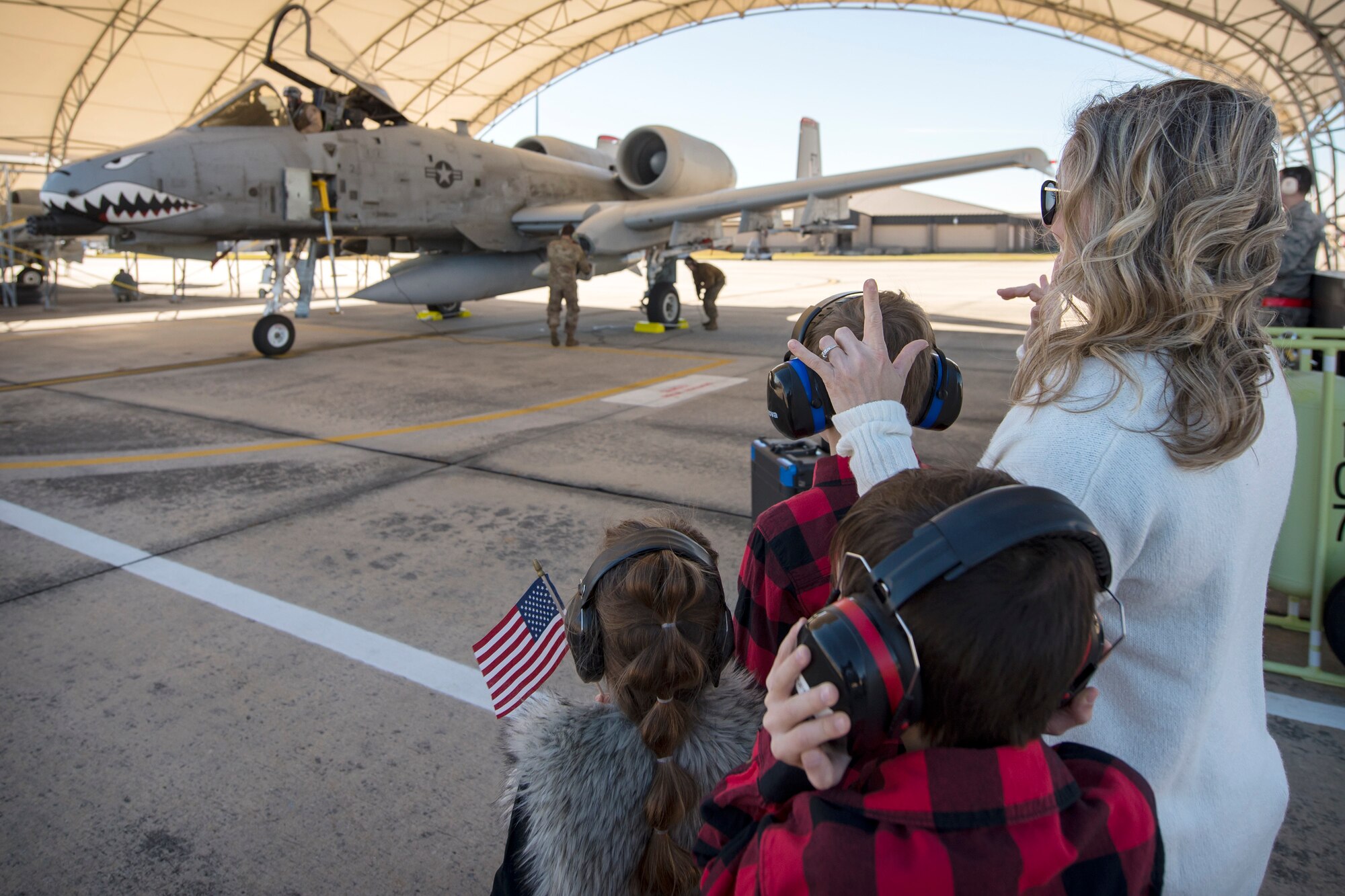 The Family of Lt Col. Sean Hall, 75th Fighter Squadron commander, prepare to greet him after returning from supporting Operation Freedom Sentinel, Jan. 25, 2019, at Moody Air Force, Ga. Reintegration events like these are especially important to Moody’s Airmen and their families as Moody is the most deployed base in Air Combat Command. (U.S. Air Force photo By Airman First Class Eugene Oliver)