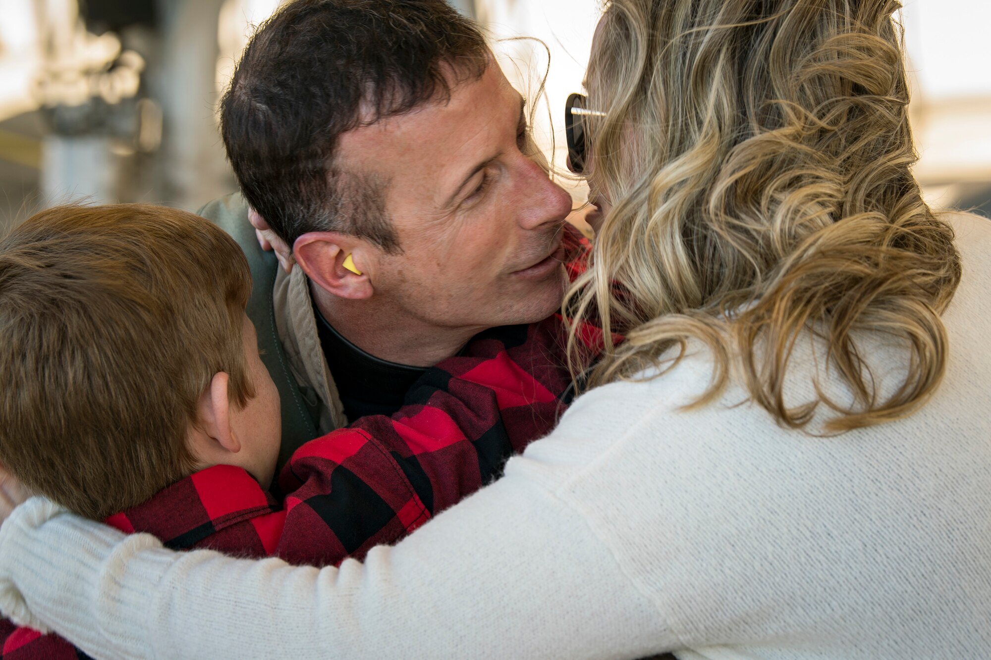 Lt. Col. Sean Hall, center, 75th Fighter Squadron commander, embraces his family after returning from supporting Operation Freedom’s Sentinel, Jan. 25, 2019, at Moody Air Force Base, Ga. Reintegration events like these are especially important to Moody’s Airmen and their families as Moody is the most deployed base in Air Combat Command. (U.S. Air Force photo By Airman First Class Eugene Oliver)