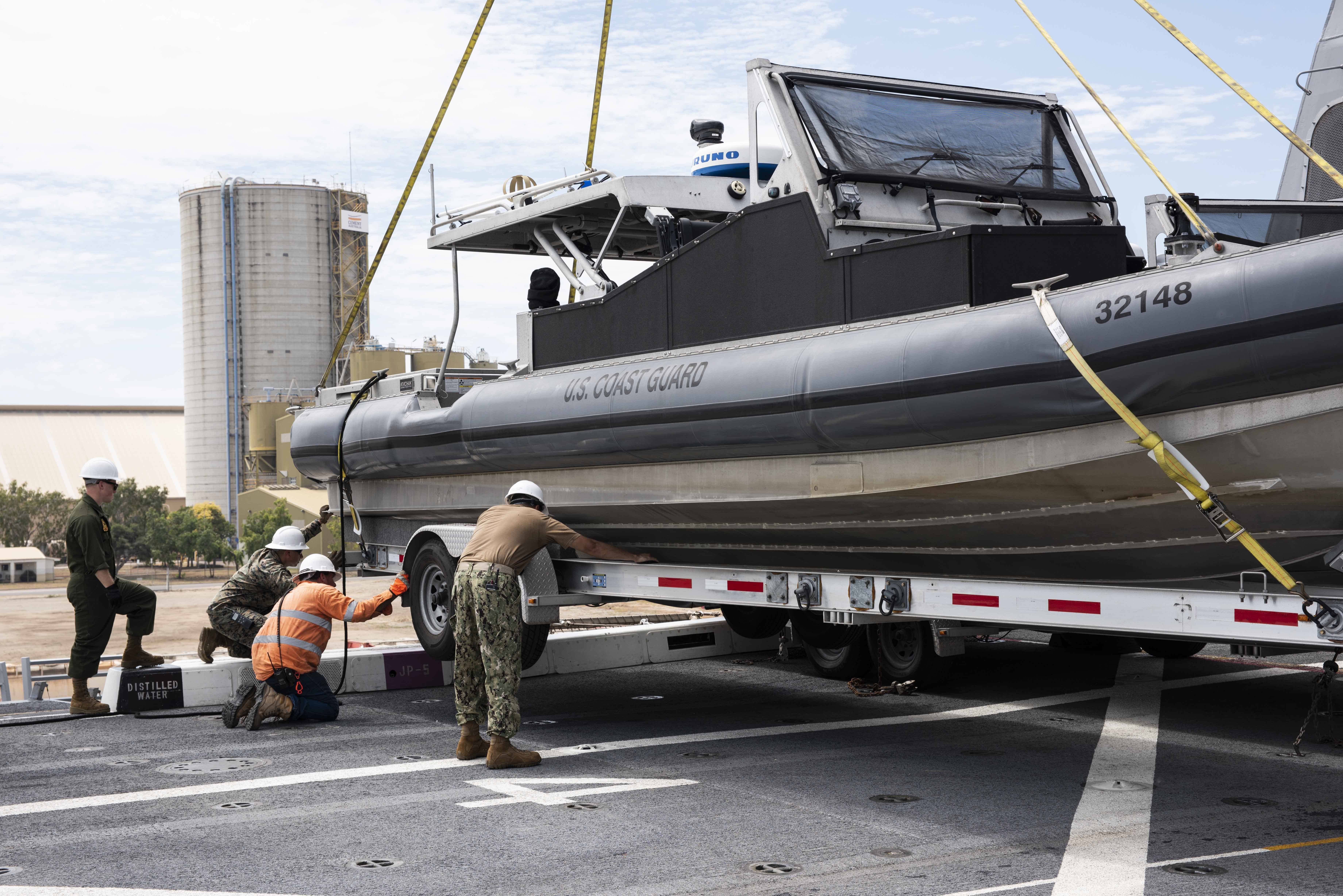 Uss Green Bay Loads Uscg Boats