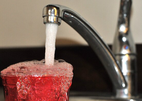 Drinking water flows from a kitchen faucet at Malmstrom Air Force Base, Mont., Jan. 29, 2019. (Air Force photo by John Turner)