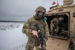 U.S. Army Cpl. Wendal Asberry, a Task Force Raider infantryman, dismounts a Bradley Fighting Vehicle during a training exercise for Operation Raider Lightning at Bemowo Piskie Training Area, Poland, Jan. 17, 2019. Raider Lightning is a series of live-fire training exercises, day and night, conducted to better enhance combat readiness operations in even the most inconvenient terrain and circumstance.